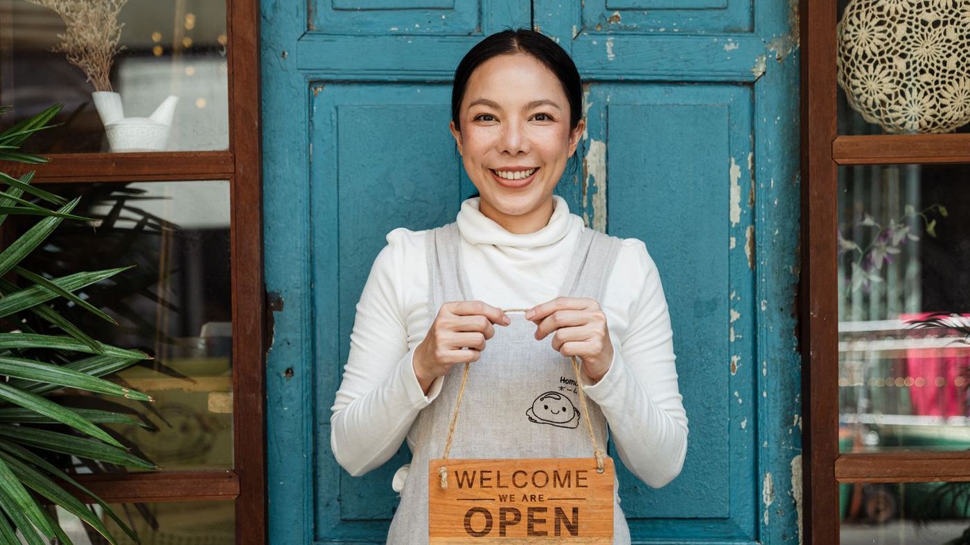 An owner with an open sign, which is the honest scale of who we are talking to